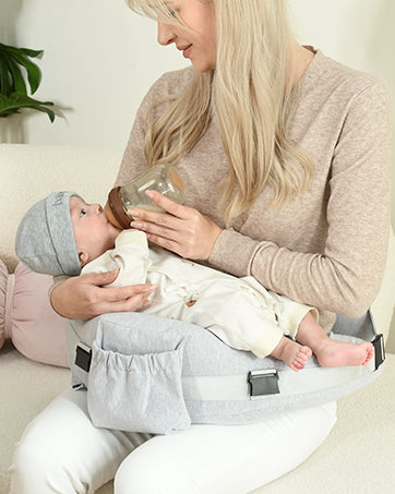 Caregiver using the nursing pillow during an awake feeding session
